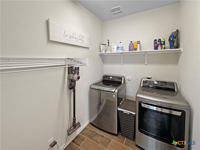 327 Steele Way, Cibolo, TX 78108 - laundry area featuring washing machine and clothes dryer and dark tile patterned flooring
