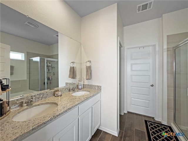 327 Steele Way, Cibolo, TX 78108 - full bathroom featuring a stall shower, double vanity, wood finished floors, and a tub to relax in
