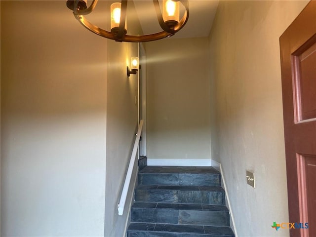 116 Campbell Dr Unit 9, Canyon Lake, TX 78133 - stairs featuring baseboards and a chandelier