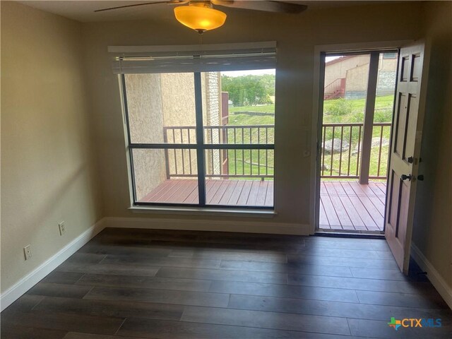 116 Campbell Dr Unit 9, Canyon Lake, TX 78133 - doorway featuring healthy amount of natural light, baseboards, a ceiling fan, and dark wood-style floors