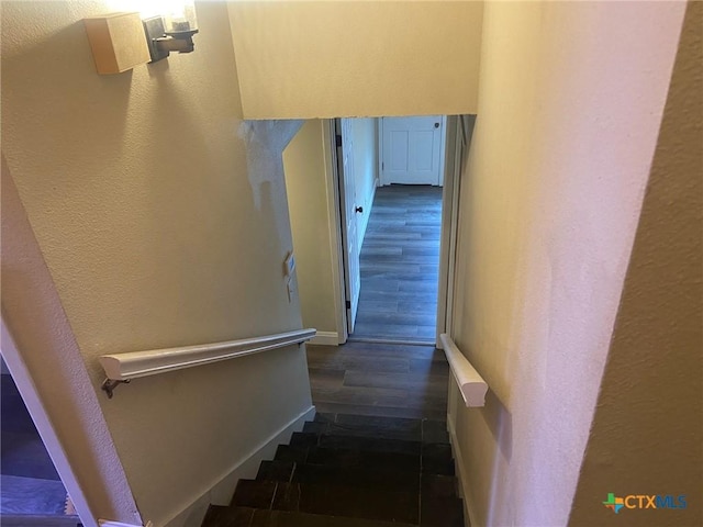 116 Campbell Dr Unit 9, Canyon Lake, TX 78133 - stairs with wood finished floors, a textured wall, and baseboards