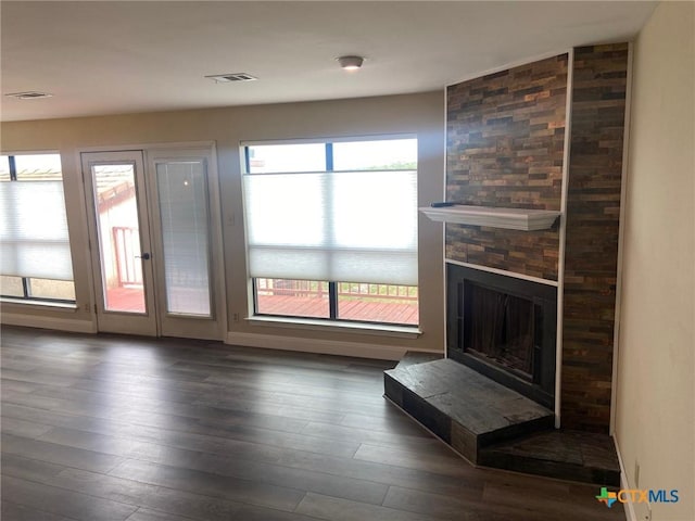 116 Campbell Dr Unit 9, Canyon Lake, TX 78133 - unfurnished living room featuring wood finished floors and a fireplace