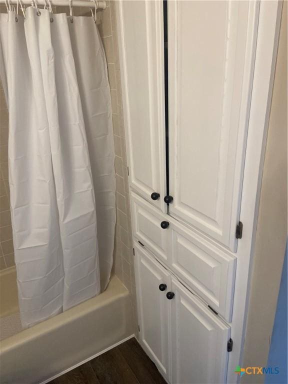 116 Campbell Dr Unit 9, Canyon Lake, TX 78133 - bathroom with shower / bath combo with shower curtain and wood finished floors