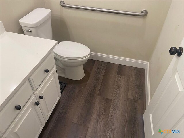 116 Campbell Dr Unit 9, Canyon Lake, TX 78133 - bathroom featuring vanity, wood finished floors, and toilet