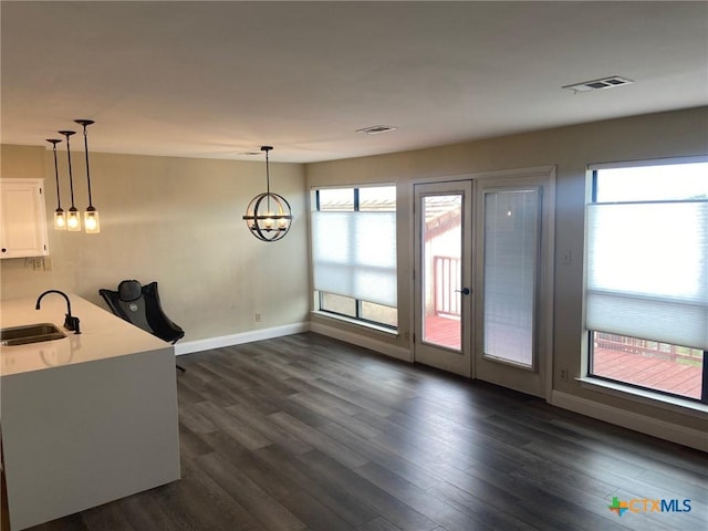 116 Campbell Dr Unit 9, Canyon Lake, TX 78133 - kitchen featuring a sink, plenty of natural light, dark wood-style flooring, and hanging light fixtures