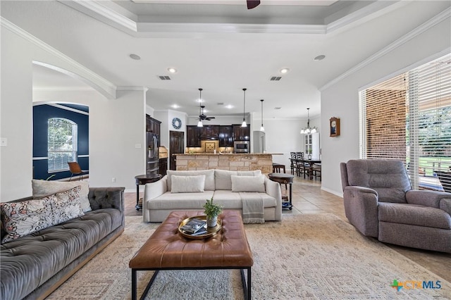 965 Ridgeoak Dr, Belton, TX 76513 - living area featuring a ceiling fan, crown molding, arched walkways, light tile patterned floors, and recessed lighting