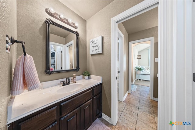 965 Ridgeoak Dr, Belton, TX 76513 - bathroom featuring vanity, a textured wall, and tile patterned floors