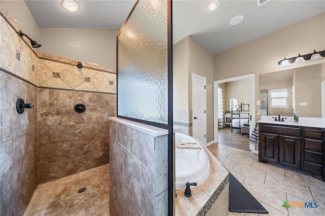 965 Ridgeoak Dr, Belton, TX 76513 - bathroom with a garden tub, a walk in shower, vanity, and tile patterned flooring