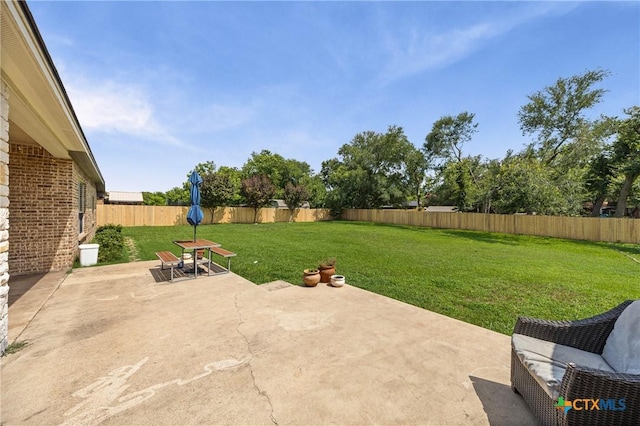 965 Ridgeoak Dr, Belton, TX 76513 - fenced backyard with a patio area