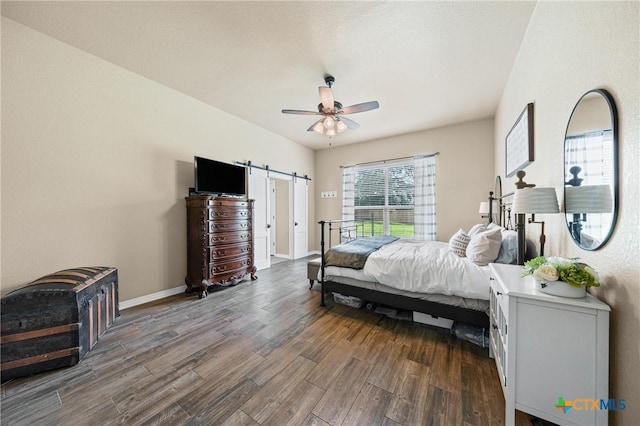 965 Ridgeoak Dr, Belton, TX 76513 - bedroom featuring dark wood-style flooring, a barn door, and ceiling fan
