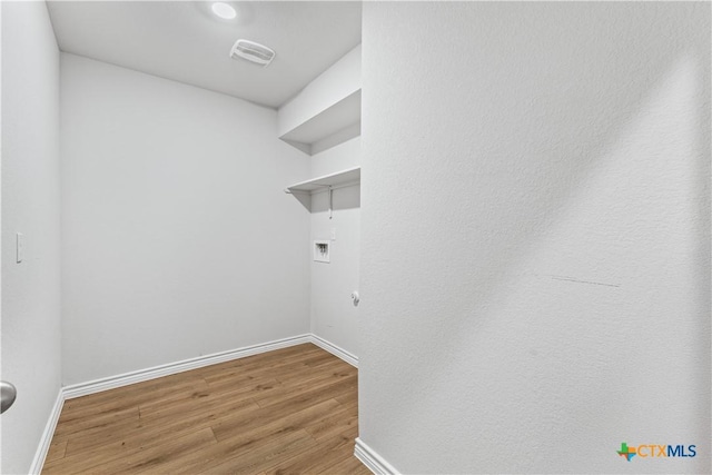 5836 Copano Rd, Belton, TX 76513 - washroom with hookup for a washing machine, gas dryer hookup, and wood finished floors