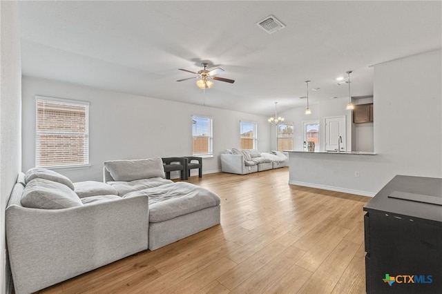 5836 Copano Rd, Belton, TX 76513 - living area with a ceiling fan, light wood-type flooring, and a chandelier