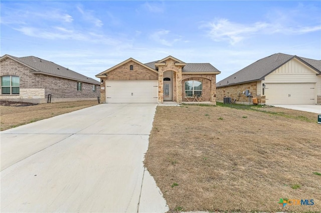 5836 Copano Rd, Belton, TX 76513 - view of front of property with brick siding, a garage, and driveway