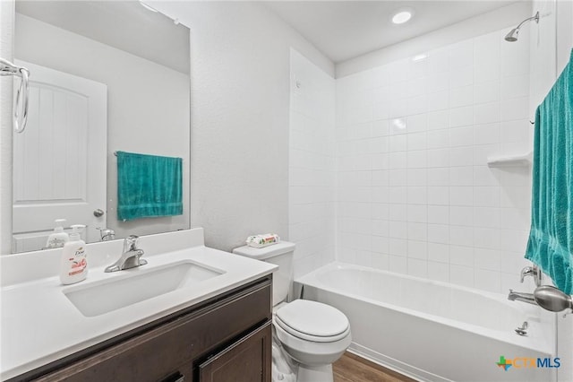 5836 Copano Rd, Belton, TX 76513 - full bath with vanity, shower / bath combination, wood finished floors, and recessed lighting