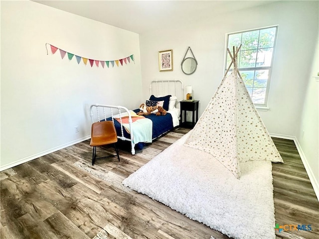 bedroom featuring wood-type flooring