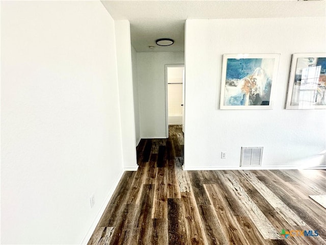 hallway featuring dark hardwood / wood-style floors