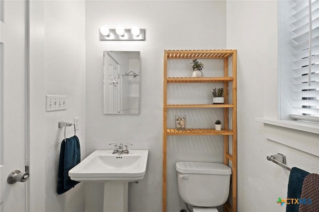 bathroom with toilet and sink