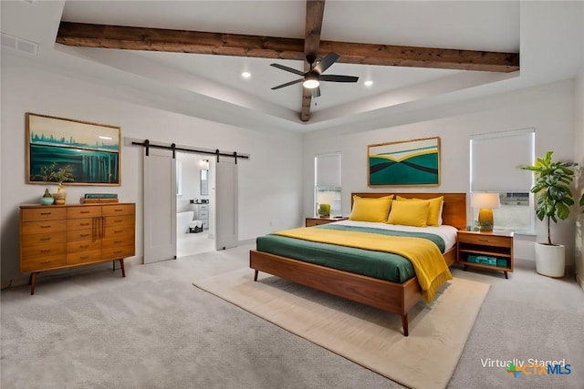 carpeted bedroom with beam ceiling, recessed lighting, visible vents, a barn door, and ensuite bath