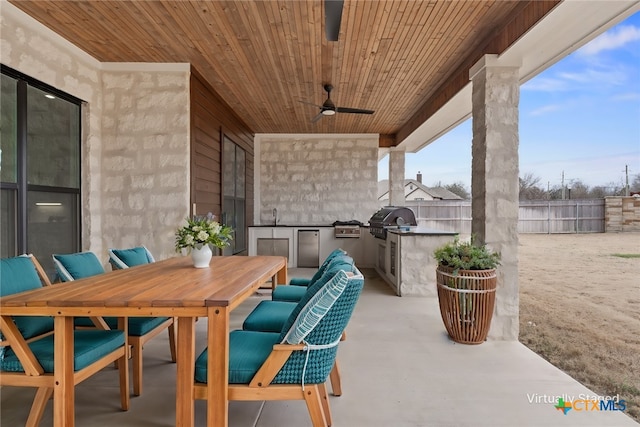 view of patio with ceiling fan, outdoor dining space, area for grilling, and a fenced backyard