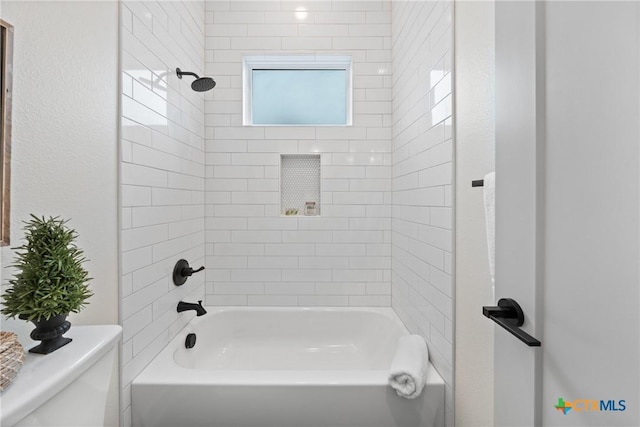 full bath featuring bathing tub / shower combination and toilet