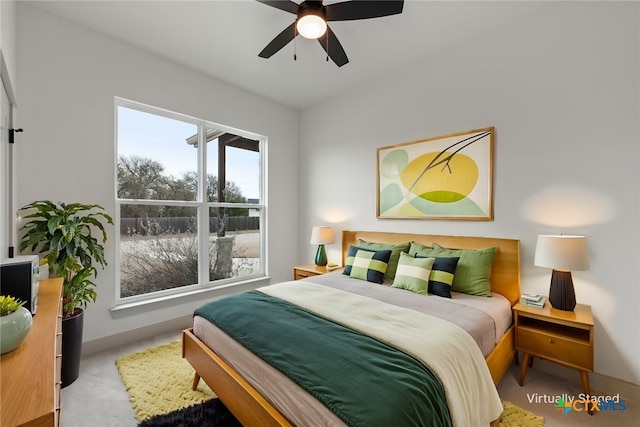 bedroom featuring a ceiling fan and baseboards