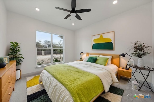 carpeted bedroom featuring a ceiling fan, recessed lighting, and baseboards