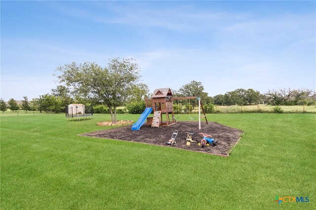 304 Campo Colinas Dr, Bertram, TX 78605 - view of play area featuring a yard and a shed
