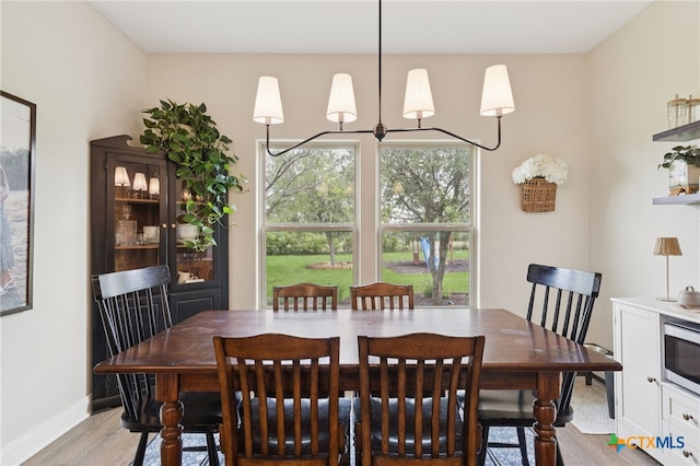 304 Campo Colinas Dr, Bertram, TX 78605 - dining area featuring light wood-style flooring and baseboards