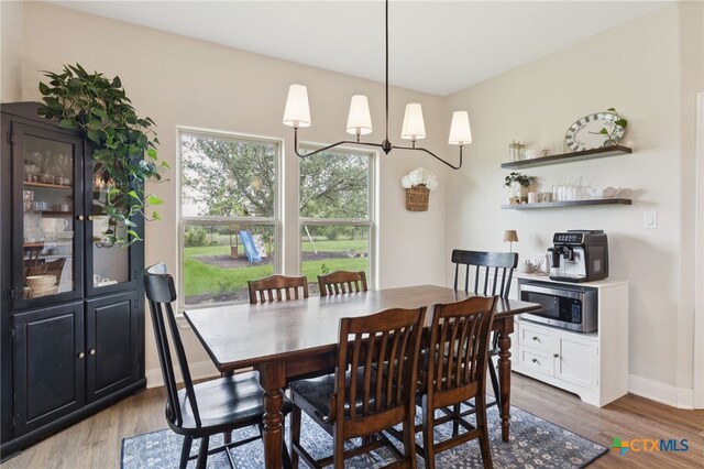 304 Campo Colinas Dr, Bertram, TX 78605 - dining area featuring wood finished floors
