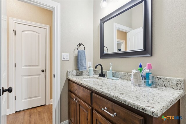 304 Campo Colinas Dr, Bertram, TX 78605 - bathroom with vanity and wood finished floors