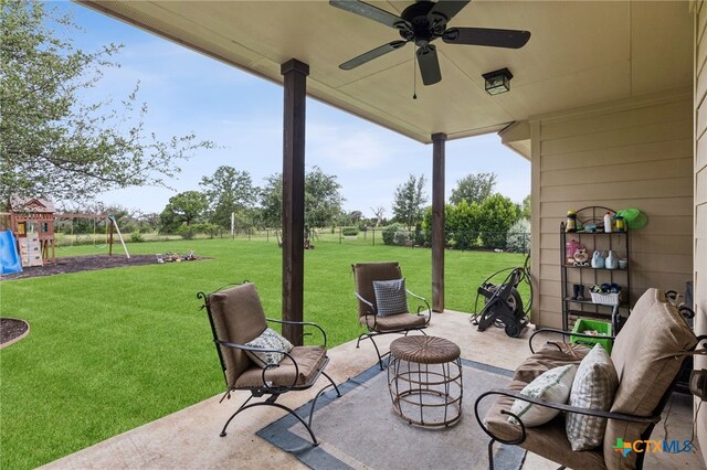 304 Campo Colinas Dr, Bertram, TX 78605 - view of patio / terrace featuring a ceiling fan and a playground