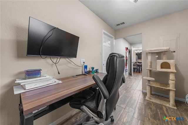 home office with wood-type flooring