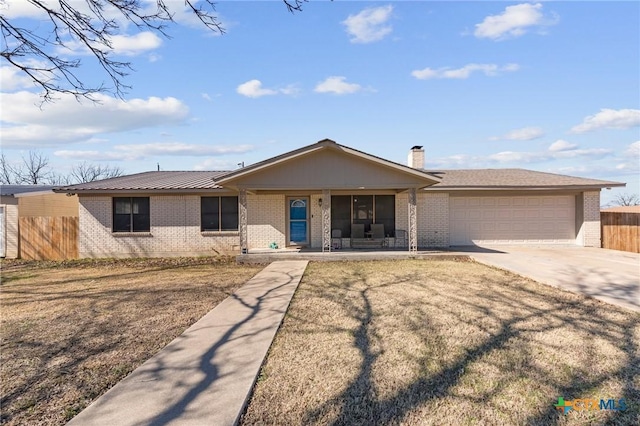 single story home with a garage, covered porch, and a front lawn