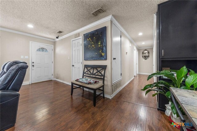 living room featuring crown molding, a textured ceiling, dark hardwood / wood-style floors, and ceiling fan