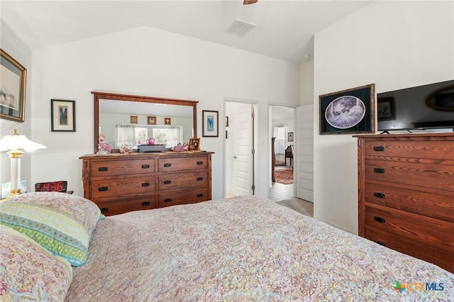 128 Riverhill Dr, Georgetown, TX 78628 - bedroom featuring vaulted ceiling and ceiling fan