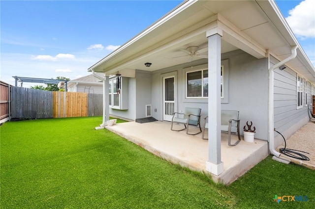 128 Riverhill Dr, Georgetown, TX 78628 - rear view of house featuring a patio, stucco siding, and a ceiling fan