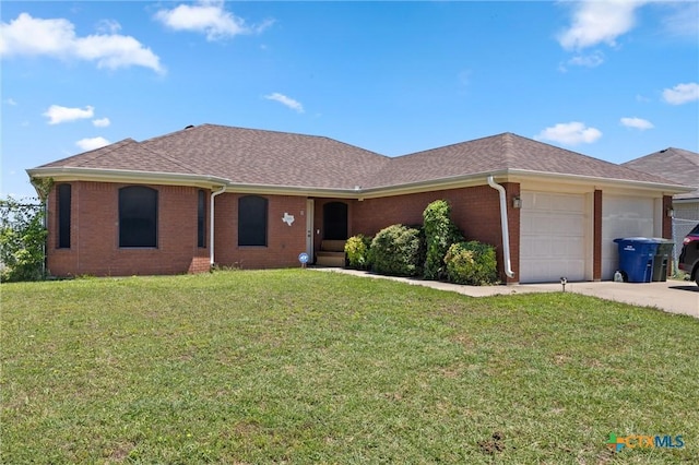 2416 Griffin Dr, Copperas Cove, TX 76522 - ranch-style house featuring brick siding, a front lawn, a garage, and a shingled roof