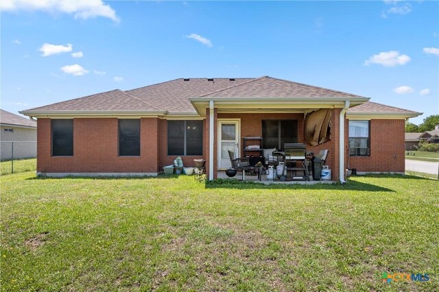 2416 Griffin Dr, Copperas Cove, TX 76522 - back of house with a patio, brick siding, and a shingled roof