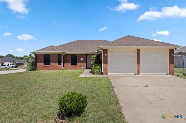 2416 Griffin Dr, Copperas Cove, TX 76522 - single story home with brick siding, an attached garage, concrete driveway, and a shingled roof
