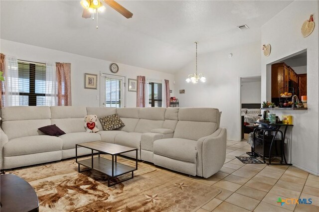 2416 Griffin Dr, Copperas Cove, TX 76522 - living area with ceiling fan, light tile patterned flooring, vaulted ceiling, and a chandelier
