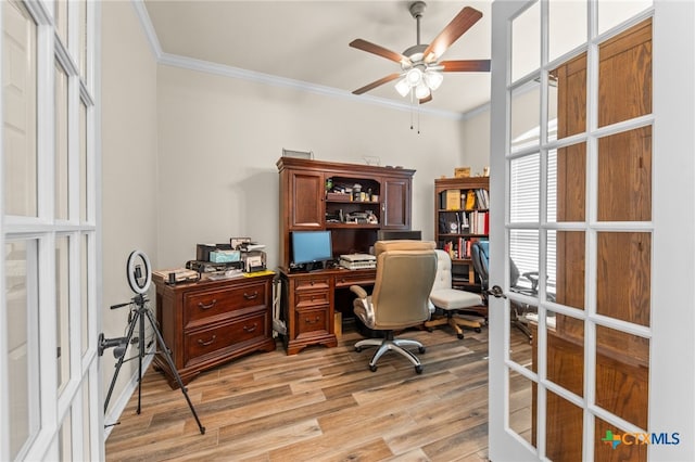 office featuring french doors, light hardwood / wood-style floors, ceiling fan, and crown molding