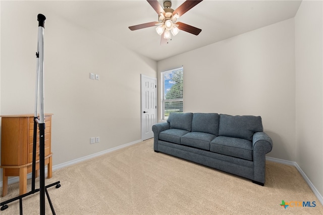 living area with light colored carpet and ceiling fan