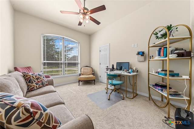 carpeted home office featuring ceiling fan