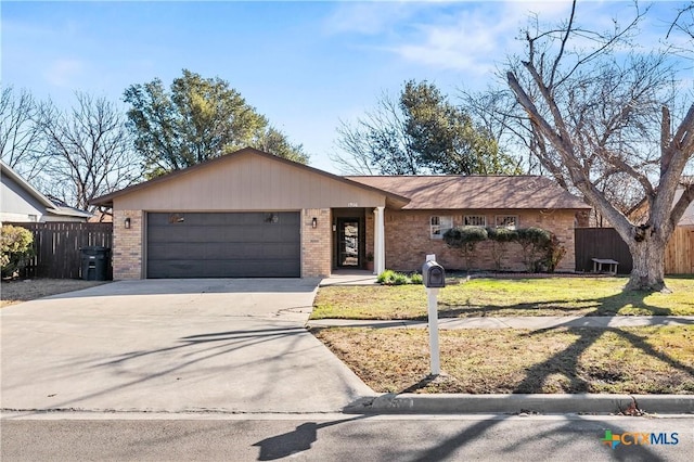 ranch-style house with a front yard and a garage