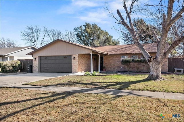 ranch-style home with a garage and a front lawn