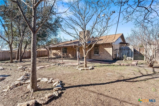 back of property with a patio