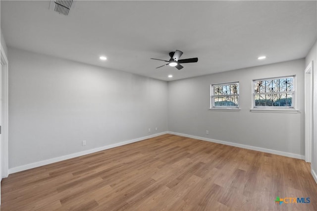 unfurnished room featuring ceiling fan and light hardwood / wood-style flooring