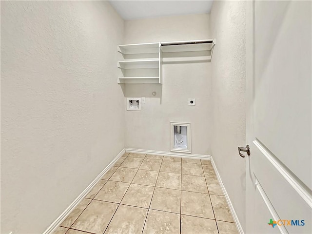 2241 Windswept Wy Way, New Braunfels, TX 78132 - laundry area with hookup for an electric dryer, gas dryer hookup, hookup for a washing machine, a textured wall, and light tile patterned floors
