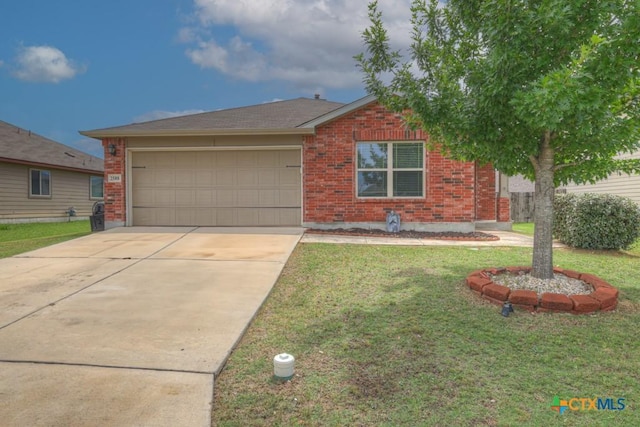2588 Diamondback Trl, New Braunfels, TX 78130 - view of front facade featuring brick siding, an attached garage, driveway, and a front yard