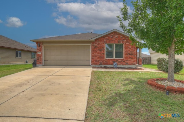 2588 Diamondback Trl, New Braunfels, TX 78130 - view of front of home featuring brick siding, an attached garage, and a front yard